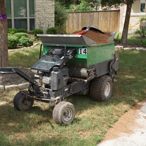 Professional lawn equipment operating in a Round Rock, Texas lawn