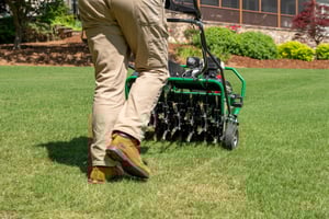 lawn tech aerating lawn in cave springs