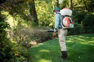 technician spraying for mosquitos in bentonville yard